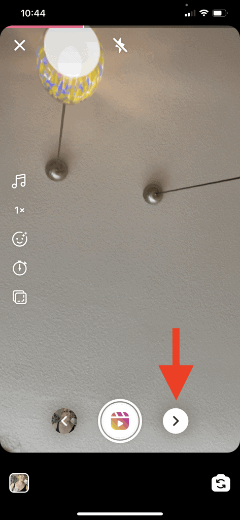 Screenshot of an Instagram Reel in the process of being made. A video has been added and a red arrow points to the arrow that takes the user to the next page of editing the Reel.